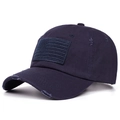 Close-up detail of a navy blue distressed baseball cap featuring a USA flag patch - Navy Blue