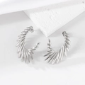 Boucles d'oreilles modernes en acier inoxydable argenté en forme d'ailes sur pierre - Argenté