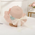 Detailed view of pink straw hat featuring lace trim, mesh bow, and pearl butterfly embroidery - Pink Hat