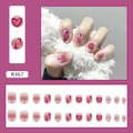Detalle de uñas postizas en degradado rosa con motivos de corazones y estrellas, 24pzs - R367 Corazón Estrella Estilo Pegamento