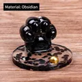 Cat paw figurine made of black obsidian crystal stone with a transparent round base - Obsidian