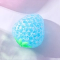 Blue translucent strawberry squishy toy with realistic texture and green leaf detail - Crystal Strawberry Blue