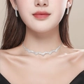 Sparkling silver-tone necklace and drop earrings set with pavé white zircons on model - Wavy Design Pave Rhinestone Set (DTN10026302S)