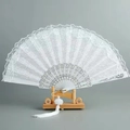 Elegant white lace folding fan with silver ornate ribs and a white silk tassel charm - Double Layer White Lace Fan - With Tassel