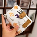 Short trifold floral canvas wallet in white with yellow flowers and a snap closure - Handheld White Floral Pattern