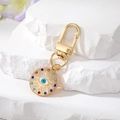 Bohemian gold metal evil eye keychain with colorful rhinestones on stone background - Gold Multi-Rhinestone Blue & White Eye