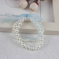 White faux pearl children's bracelet featuring a light blue ribbon bow decoration - Double Layer 6MM+8MM Cream Pearl With Blue Ribbon Bracelet