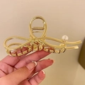 Pince à cheveux élégante en métal doré avec nœud torsadé et détail de perle blanche - Noeud de Perles / Or
