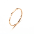 Detail of slim rose gold titanium steel ring with smooth polished minimalist surface - US 5 / 2MM Flat Style / Rose Gold