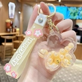 Cherry blossom keychain with liquid floating gold pearls and yellow wristband - Pearl Sakura - Yellow