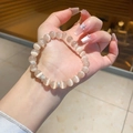 Gros plan de perles œil-de-chat champagne avec breloque étoile et anneaux en zircon - Bracelet Etoile en Pierre Oeil de Chat Champagne (Avec Boîte Cadeau)