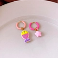 Detail view of asymmetric fish and star titanium steel earrings with drip oil finish - Pink Fish (WE3799)