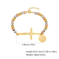 Detailed view of tricolor beaded bracelet with a gold cross and Saint Benedict medal charm - St. Benedict Medal / Colorful