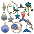 Assorted ocean-themed enamel charms featuring sea shells starfish and mermaid tails - 12Pcs Blue Ocean Series