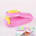 Portable mini food bag sealer in pink and yellow finish with compact hand-held design - Pink Base Yellow Lid