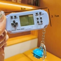 Mini handheld Tetris game console keychain in light blue with bell charm and chain - Long Handle Blue Mini Game Console