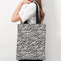Versatile canvas tote bag featuring a bold black and white zebra pattern with a wide strap - Double-sided Zebra