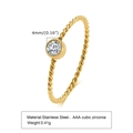 Detail view of 4mm cubic zirconia on gold stainless steel twisted ring band - US Size 9 / Zircon Gold