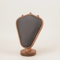 Detail of shield-shaped walnut wood jewelry display stand with black velvet surface - Walnut Black Leather