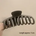 Matte dark grey 11cm hair claw clip for thick hair shown in a hand-held view - Matte Dragon Bone Coffee-11cm