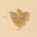 Macro view of gold butterfly pendant with cubic zirconia, size 2.2cm by 2.3cm - U-Shiny Butterfly (2.2x2.3cm)