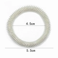 Macro view of silver spring massage ring showing 4.5cm inner and 5.5cm outer diameters - Spring Wristband Silver