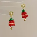 Detail of handmade beaded Christmas tree earrings with festive red and green colors - Snowflake Bell-Silver Pin / Stud Earrings