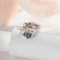 Silver huggie earring featuring a leaf texture design and a dark grey round cut zircon - Grey (Single)