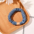 Close-up of blue polka dot scrunchie with rectangular buckle detail on a wooden tray - Satin Polka Dot Dark Blue