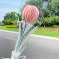 Close-up of handmade pink tulip made of pipe cleaners in a clear gift bag with a bow - Gradient Dusty Pink Tulip with Pearl Gauze