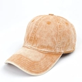 Detail view of washed cotton baseball cap in apricot orange with embroidered eyelets - Adjustable / Turmeric