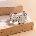 Elegant silver flower-shaped titanium steel ring with a minimalist interconnected design - Steel Color 23-1