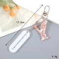 Porte-clés Y en acrylique marbré rose avec étiquette blanche et dimensions 13,5cm 9,4g - Lettre Y