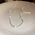 Detailed macro view of silver geometric beads and white pearls on an elegant choker necklace - Silver Crushed Silver Pearl Necklace