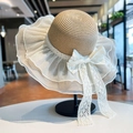 Detail of straw sun hat featuring white organza ruffles and delicate lace ribbon - Khaki Mesh Straw Hat (D-391)