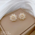 Detail view of gold snowflake earrings with micro-inlaid cubic zirconia, 1.8x1.8cm size - D126 Stud Earrings (Silver Pin Copper Gold Plated)