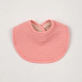 Detail of pink cotton baby bib featuring absorbent crinkled muslin fabric and soft edges - Watermelon red