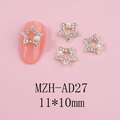 Detail of 11x10mm hollow star nail charms with white rhinestones and a small pearl accent - Gold Star with Pearl (AD27)