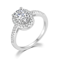 Close-up of an oval-cut AAA zircon halo engagement ring with a micro-pave silver band - Egg-shaped Platinum White Stone