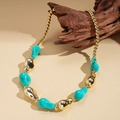 Detailed close-up of acrylic geometric beaded necklace on rustic wood background - Blue