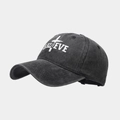 Detail view of washed cotton baseball cap with Believe embroidery and cross design - Black