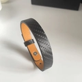 Bracelet pour homme en cuir tressé noir avec doublure orange et fermoir en acier - Bracelet Fini / Noir Texturé Microfibre