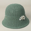 Detail of grey-green knit bucket hat featuring delicate hollow-out pattern and pearl accents - S (56-57cm) / Green