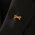 Detailed view of a gold bow brooch pinned to a black suit lapel for elegant styling - Simple Bow Style (09 Titanium Gold 8186)