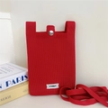 Detail of red knitted crossbody phone bag with silver snap button and textured fabric - Red