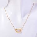Gold plated necklace with oval clear gemstone pendant on white mannequin - April Necklace