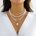 Close-up of layered faux pearl necklace with gold OT buckle and baroque heart pendant - Triple Layer Baroque Pearl Pendant OT Clasp (07 Gold Set) / Gold (3959)