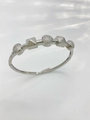 Silver geometric bangle featuring cubic zirconia spheres and pyramid studs detail - Bangle-Silver