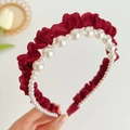 Detailed shot of burgundy pleated fabric headband with gradient white faux pearls - Pearl Mesh Pleated Headband / Red