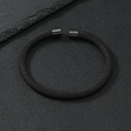 Close-up of matte black stainless steel woven mesh open bangle with textured details - 6mm / Black
